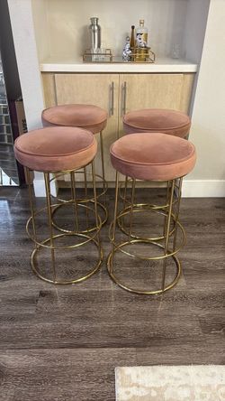 Pink and gold bar stools