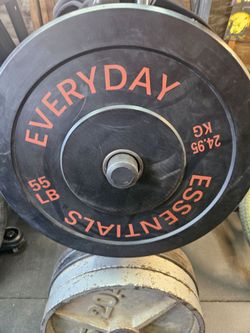 Four 55 pound bumper plates
