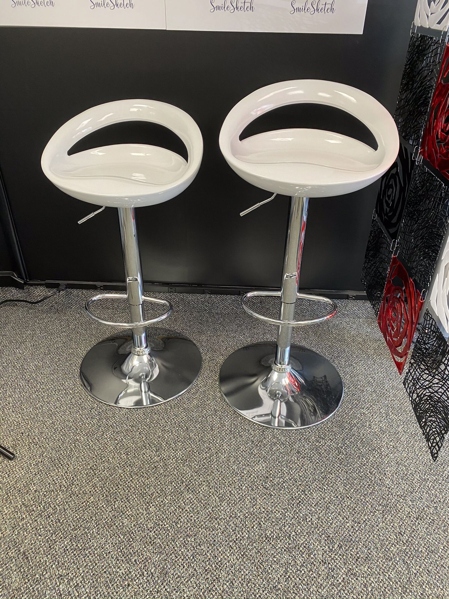 2 Carle Swivel. White adjustable height bar stools