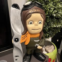 collectible aviator figurine featuring the phrase "ATTA BOY" and "374TH" on its helmet and scarf, likely representing a specific historical military s