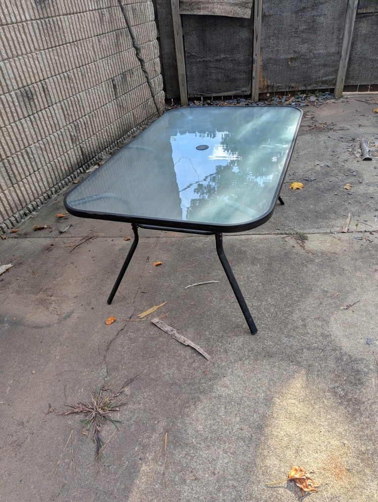 Outdoor glass top table