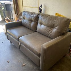 Pull Out Leather Couch.