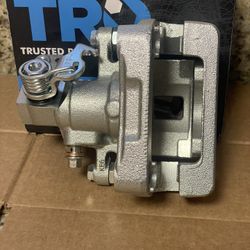 Caliper w/braket driver side(Mazda) (see pics & description).