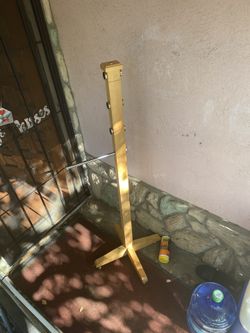 Wooden clothes rack with metal rod or can be broken down to 2 coats racks