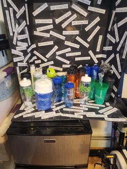 Brand new mixture of water bottles and cups 