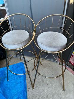 2 gold swivel counter stools $60