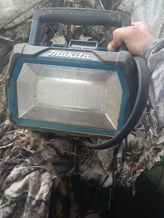 Makita Light And Battery Charger And Two Batteries