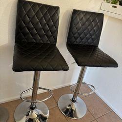 Black padded swivel bar stools