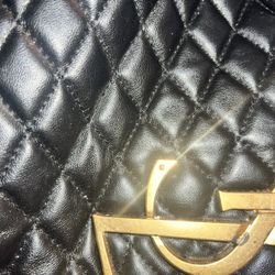 Black leather quilted tote bag with additional pouch