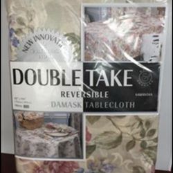 Brand new Double take reversible damask tablecloth and matching reversible 8pcs placemat sets.