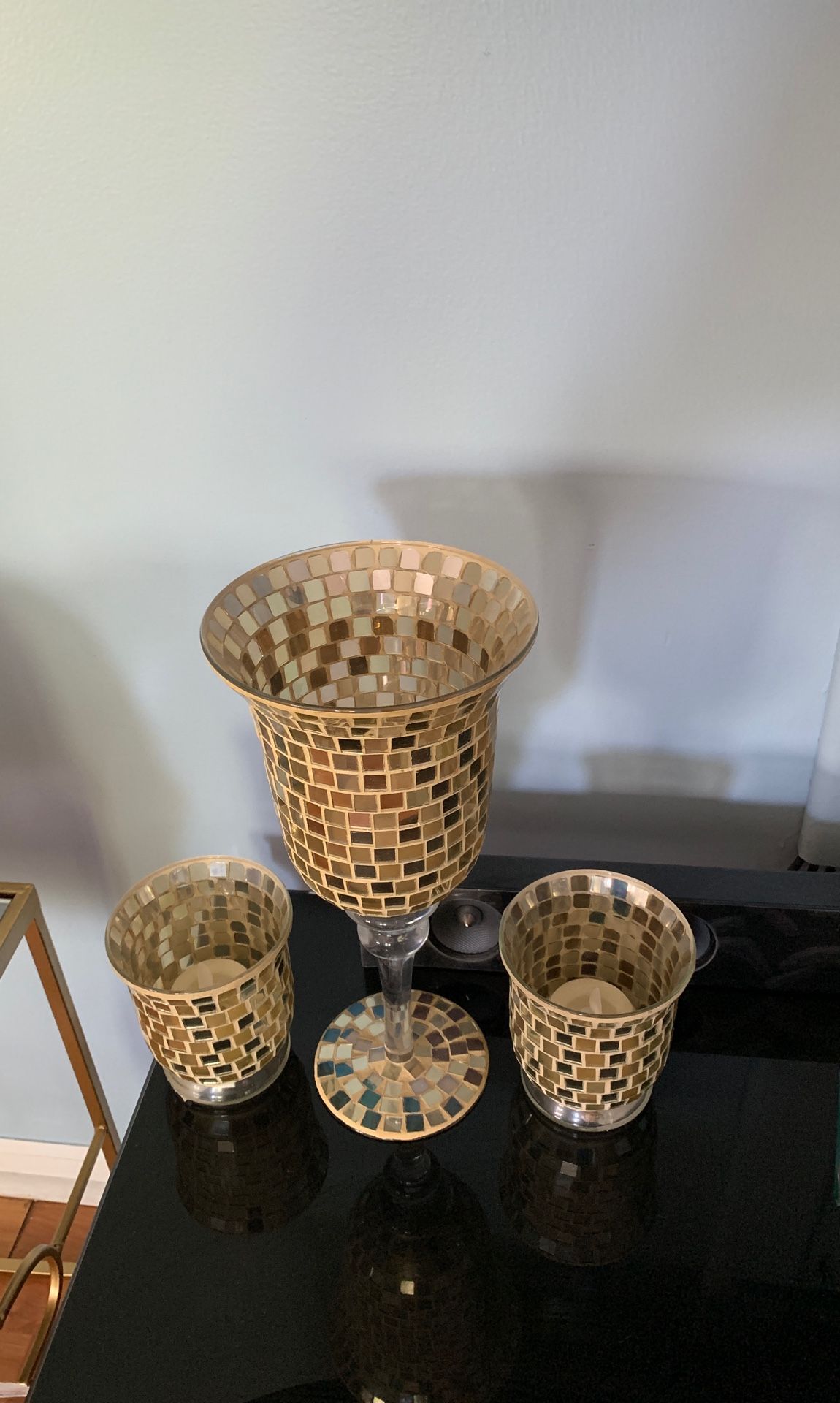 Three piece mosaic candle holder set.