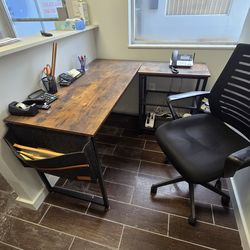 Small L shaped desk with shelves plus chair.