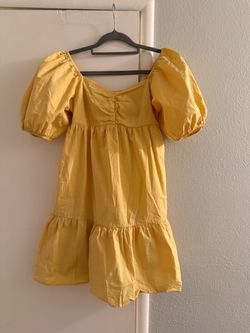 Billabong is the brand and it is like new Yellow Puff Sleeve Tiered Mini Dress
