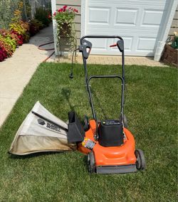 ELECTRIC LAWNMOWER WITH FLIP OVER HANDLE. INCLUDES A REAR BAG. $75.00  OR BEST OFFER.