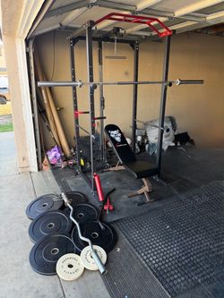 Bench press/squat rack with 7ft 45lbs bar plus 120lbs rubber coated weights and curl bar
