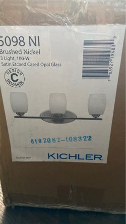 Contemporary Brand new- brushed nickel vanity light.