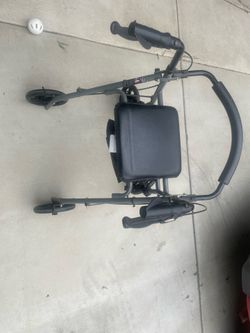 Walker with seat and brakes..