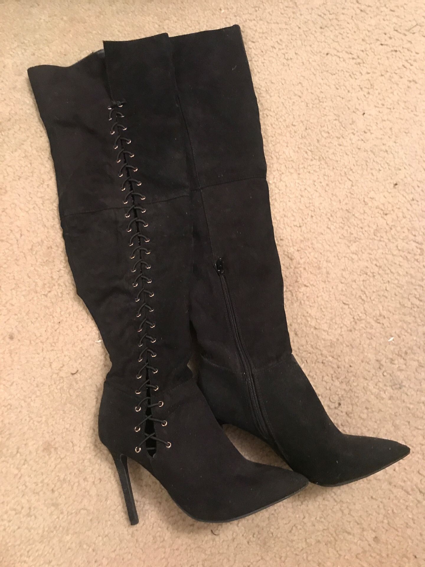 Women’s thigh-high black suede lace up boots
