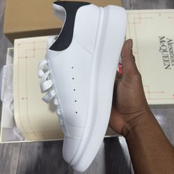 Alexander McQueen white and black leather trainers #luxurytrainers