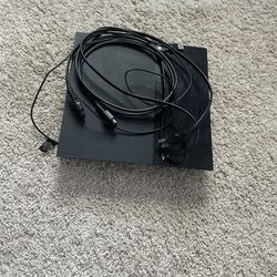 Sony PlayStation 4 console with cables, controller not included
