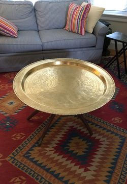 Solid brass tray/coffee table with legs. The tray is removable and can be used as a wall hanging. Made in Taiwan 1967 purchased there and brought hom