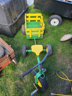 Vintage kids bike and cart yard decor John deer