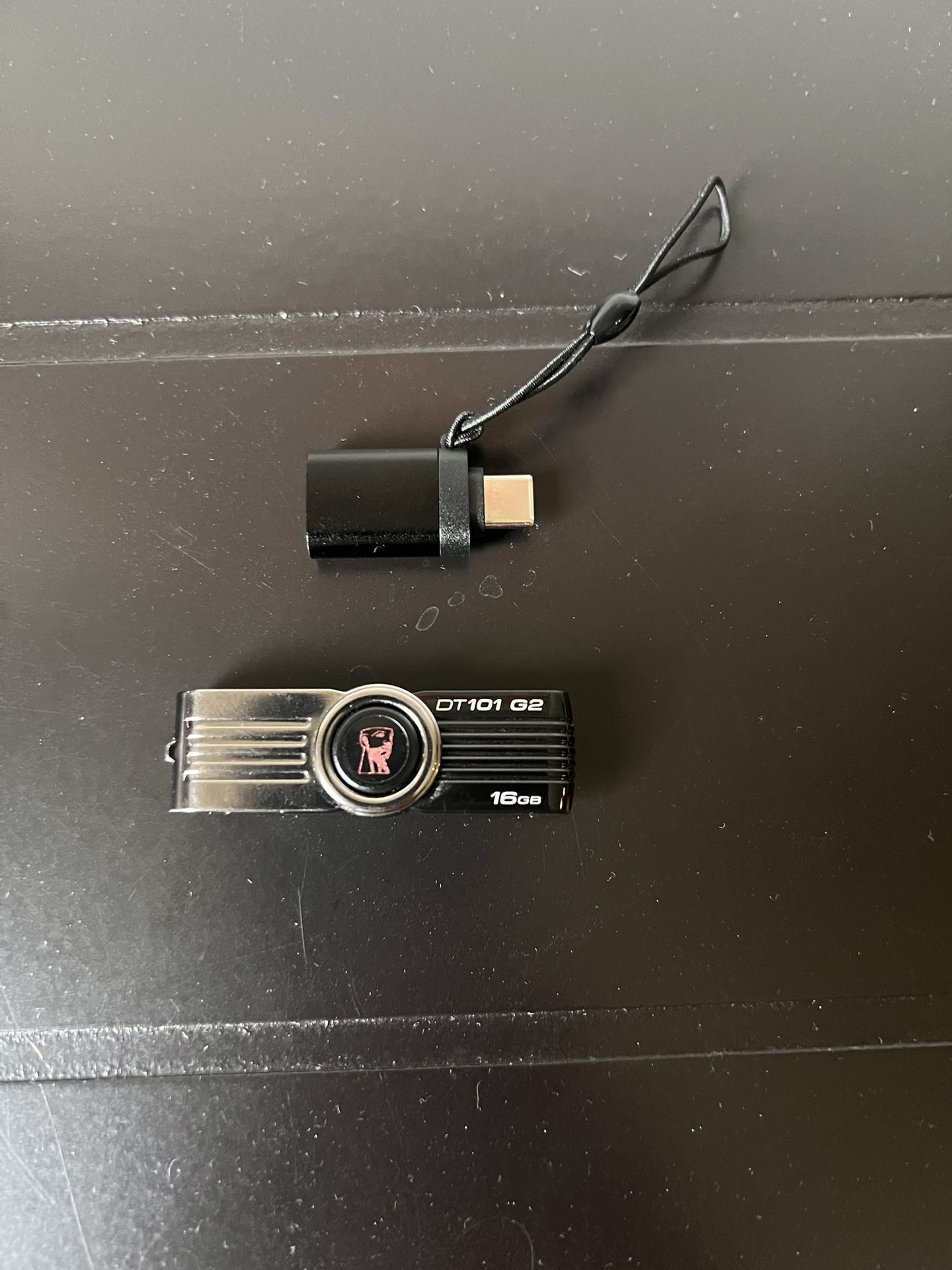 USB-C to USB-A adapter with a small lanyard