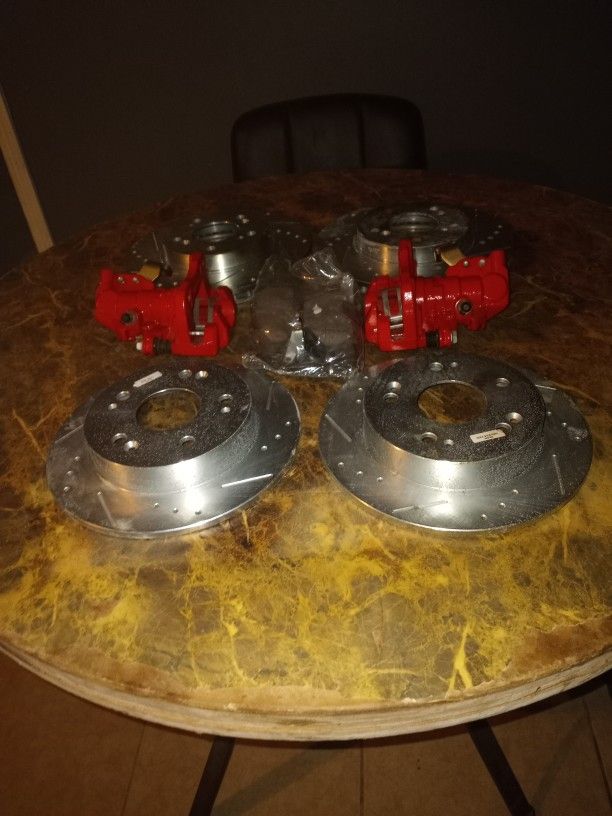Calipers, Both Rear And Front Rotors And Rear And Front Brake Pads  Brand New