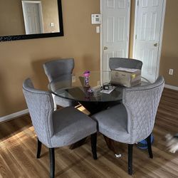 Round Table With Grey Accent Stud Chairs
