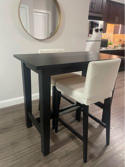Black Bar Height Dinning Table with two cream stools