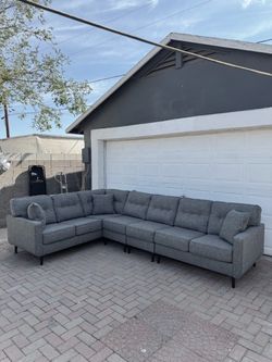 GREY SECTIONAL COUCH ***FREE DELIVERY ***