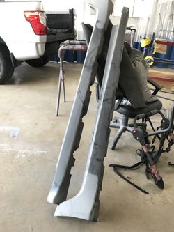 Left and right 2008 Cadillac CTS rocker panel moldings ( ready for paint )