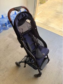 Contour folding stroller