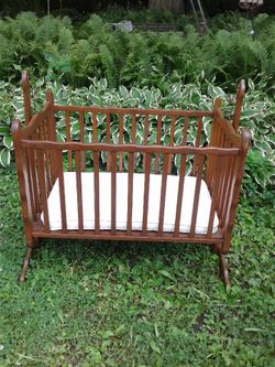 Infant wood swinging cradle from the 1970s