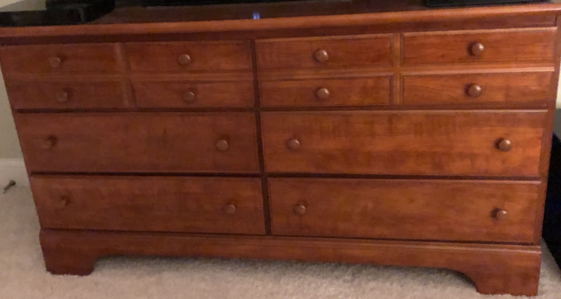 Wood 6 drawer long dresser has a matching nightstand as well