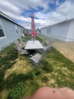 Outdoor table and six chairs umbrella