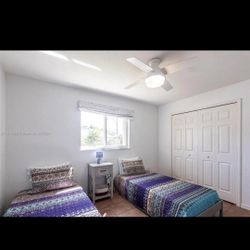 Two Twin Beds with matresses and a rug