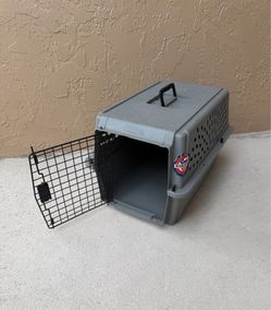 PETCO, a grey plastic travel crate designed for pets, 24 to 16,5 to 14,5 inches