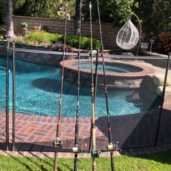 Four (4) Saltwater Fishing Rods with Reels