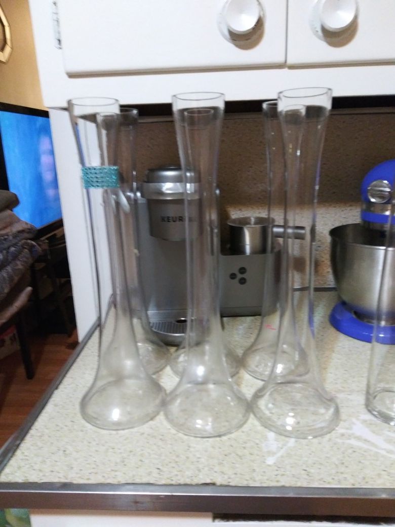 5 tall round bottom glass vases used as centerpieces for any occasion