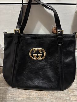 Black leather bag with gold hardware