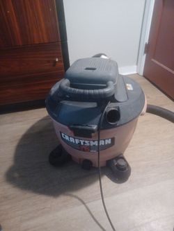 This is a Craftsman wet/dry vacuum cleaner featuring a prominent red canister design.