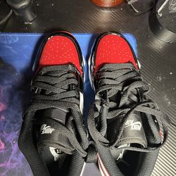 Jordan 1 Lows baseball cleats Gym Red Black and white