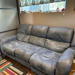 Reclining Leather Sofa And Loveseat  $200