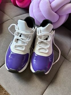 Air Jordan 11 Low Purple Patent Sneakers