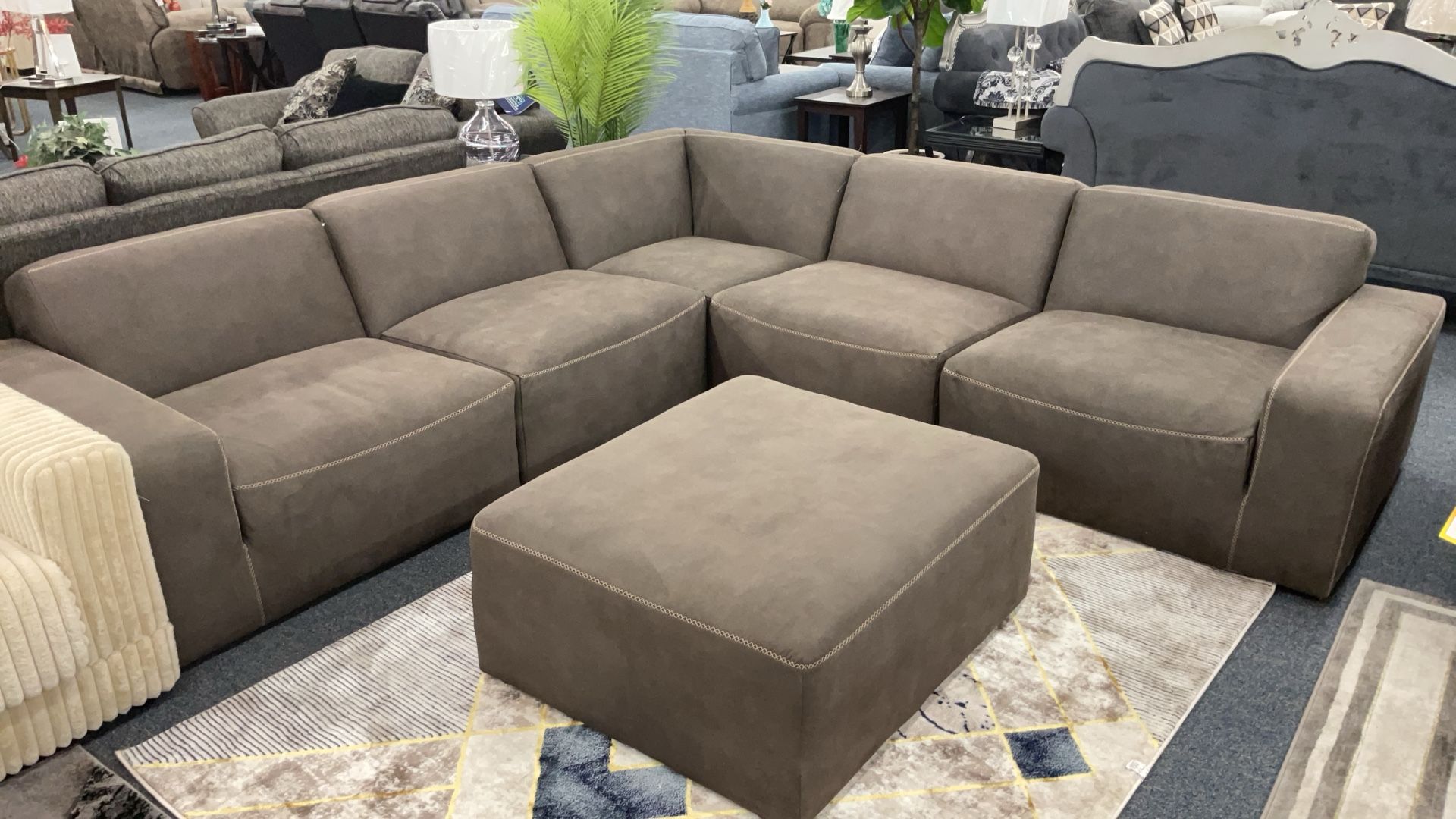 Brown Sectional Relaxing Seats With Free Ottoman 