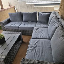 Outdoor patio sectional set with wood table