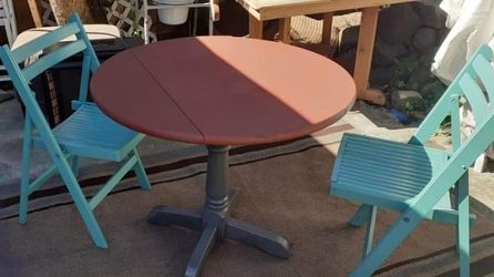 Table and two folding chairs