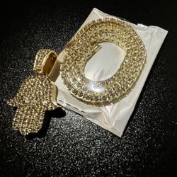 Gold, diamond, chain, and charm/pendant