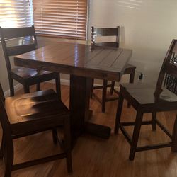 Tall wood table with chairs